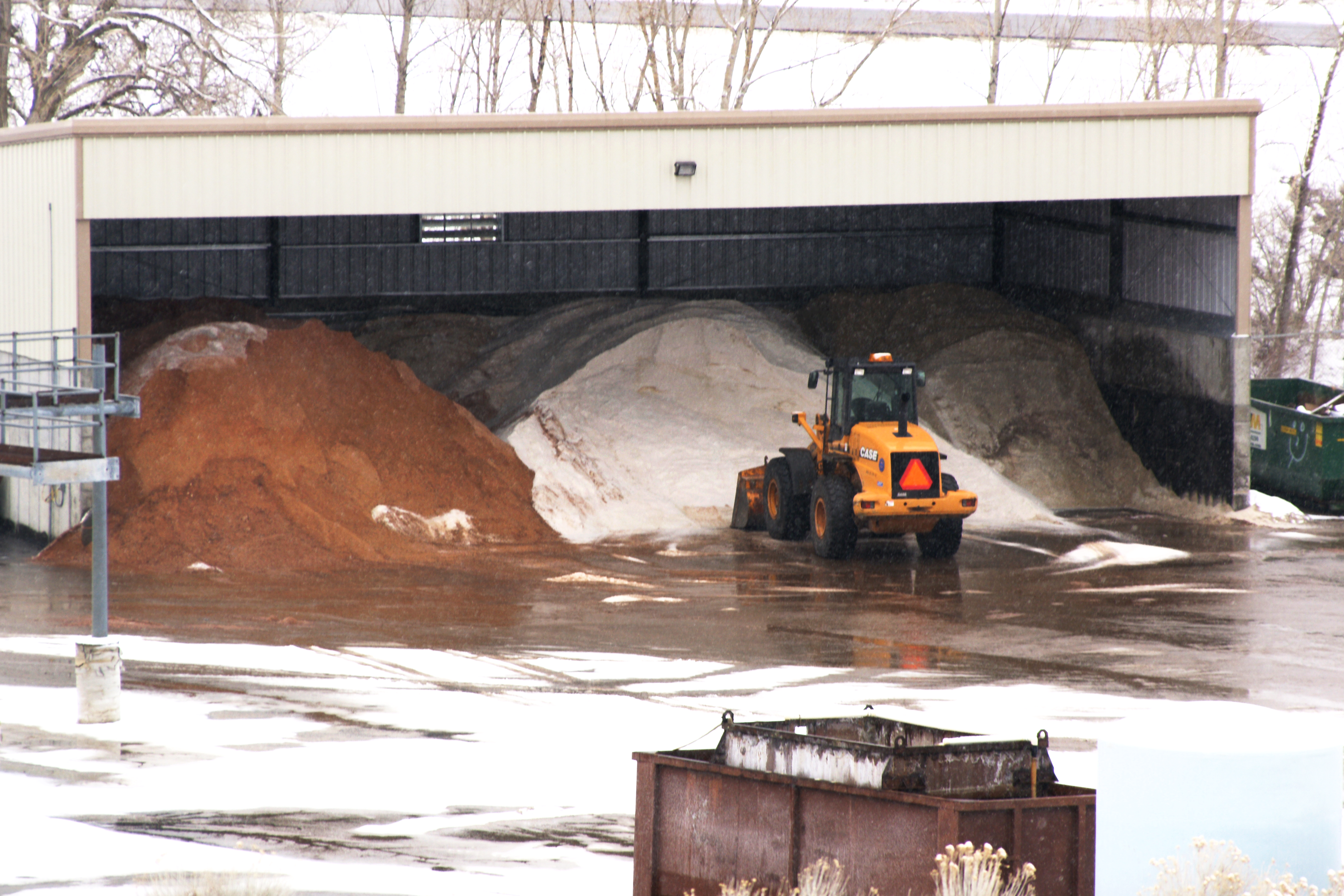 Deicer stockpiles in a show fighting shed