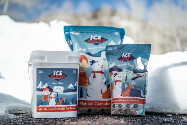 Containers of Ice Slicer Nature's Blend granular deicer