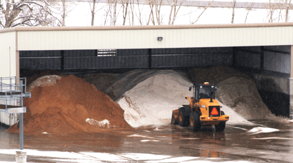 Shed with stockpiles of road deicing treatments