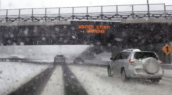 Cars driving in a winter snow storm