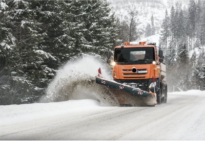 Snow fighter plowing a road