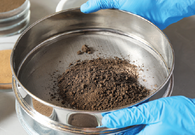 Soil particles in an industrial sieve