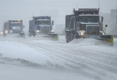 Snow plows working in tandem