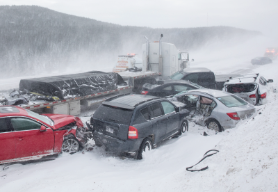 Closed winter road due to vehicle pileup